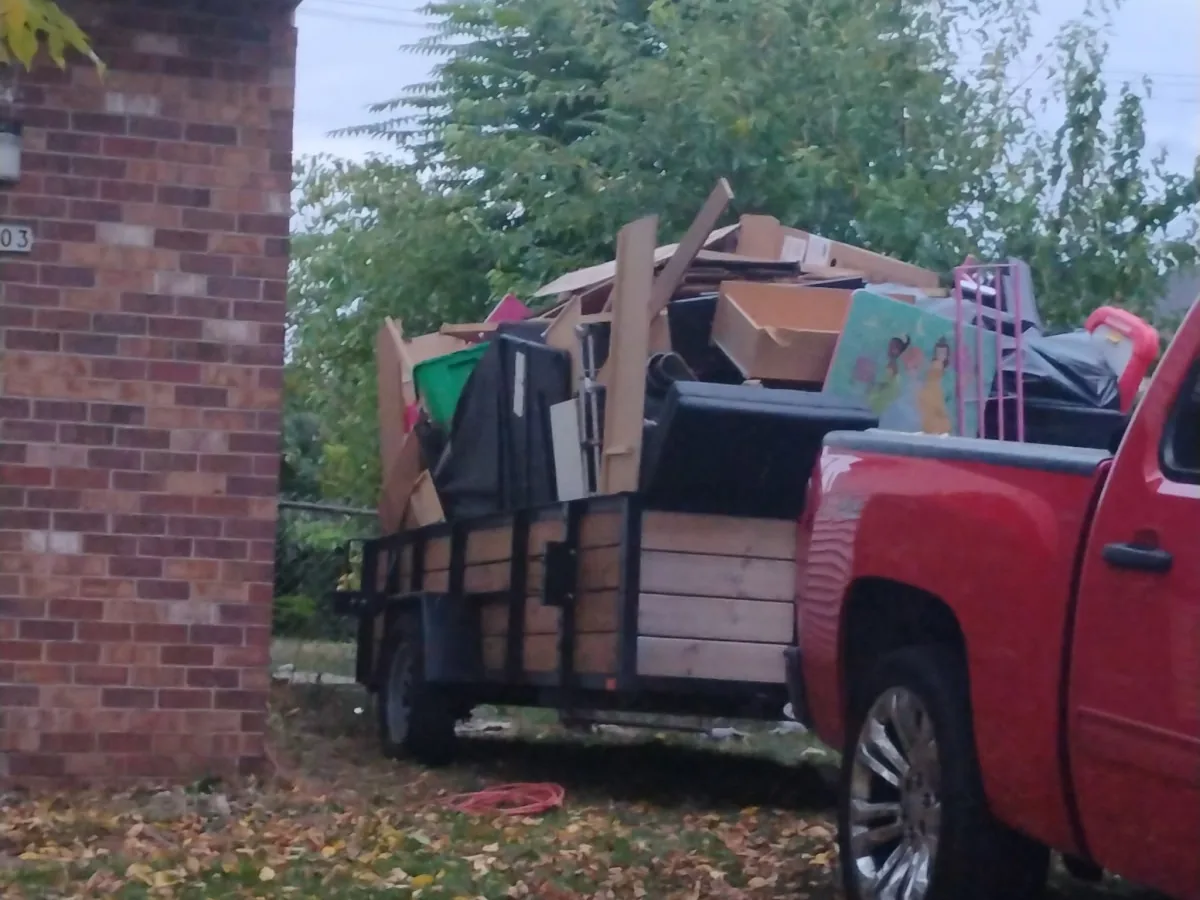 Trailer loaded with furniture and household junk for removal
